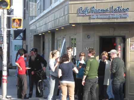 Central American food lovers mill outside Cafe Aroma Latino on Tuesday.